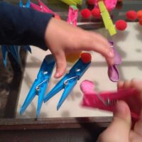 playing-with-pegs-and-pompoms